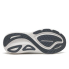 The outsole of a Saucony athletic shoe, showing a white midsole with dark gray tread patterns and the Saucony brand name embossed on the side.