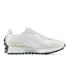 White sneaker with black sole on a white background