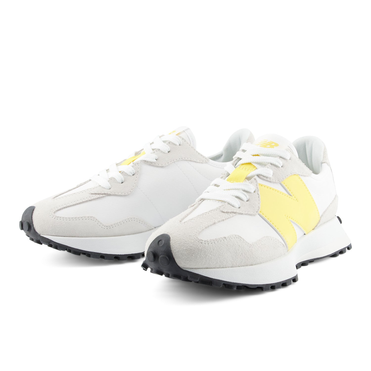 White sneakers with yellow accents on a white background