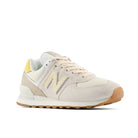 Beige sneaker with brown sole on a white background
