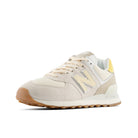 Beige sneaker with brown sole on a white background