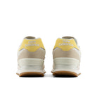 Pair of New Balance sneakers shown from the back on a white background