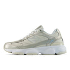 Silver sneaker with white sole on a white background