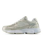 Silver sneaker with white sole on a white background