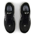 Black New Balance 860 sneakers on a white background