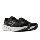Black running shoes with white soles on a white background