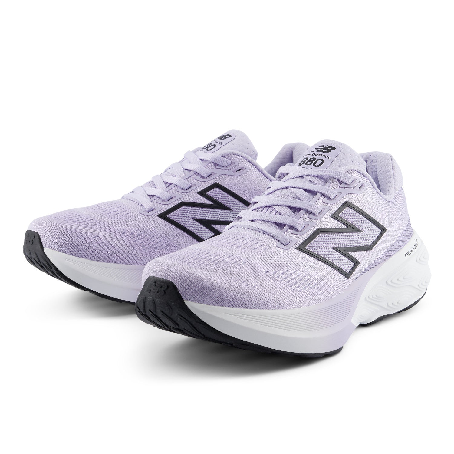 Pair of lavender running shoes with black accents on a white background