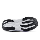 Close-up of a white athletic shoe sole with black accents on a white background