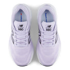 Pair of lavender running shoes with New Balance branding on a white background